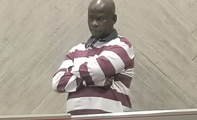 Louis Pepping gestures to gallery as he enters the coirt